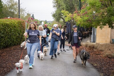 Supporters of Pet Partners' Therapy Animal Program walk with their pets during last year's World's Largest Pet Walk event. Supporters of Pet Partners' Therapy Animal Program walk with their pets during last year's World's Largest Pet Walk event.