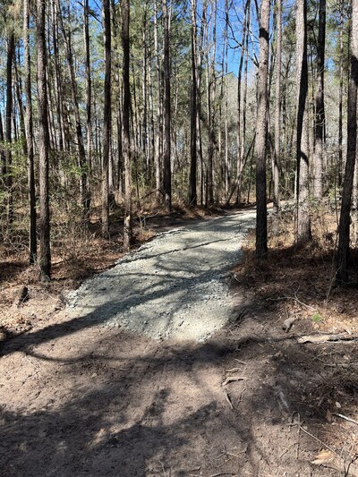 A 2025 Polaris Fund for Outdoor Recreation grant supported initial projects at Land Between the Lakes Forest in the Turkey Bay OHV Area, Kentucky including, a new paved entrance turn lane, striped traffic lanes, speed bump and safety signage installation, resurfaced parking areas, and expanded overflow camping and day-use zones.