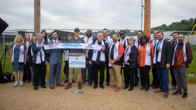 Representatives from New Energy Equity along with local officials and Harlem School District leaders and students at the project energization ceremony on June 24, 2026 in Machesney Park, IL.