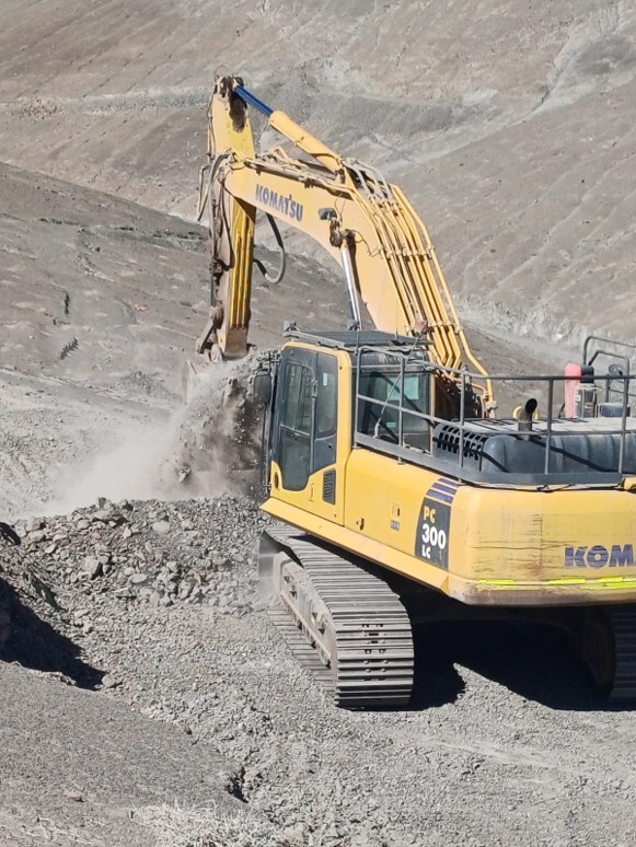 Figure 1. Komatsu PC300LC excavator constructing drill pads at the Cordillera Cobre Project, El Alto Target. (CNW Group/Super Copper Corp.) Figure 1. Komatsu PC300LC excavator constructing drill pads at the Cordillera Cobre Project, El Alto Target. (CNW Group/Super Copper Corp.)