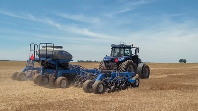 New Holland T8 NHDrive Autonomous Concept Tractor in the field with the New Holland 2085 Air Disc Drill