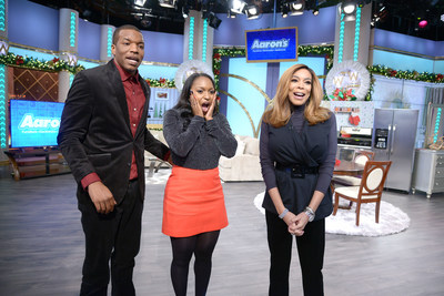 Aaron's surprised winners of the "Big Blue Bow Home Makeover" (L to R), Anthony Harper and Jasmine Dobbs with Wendy Williams, on Friday's Debmar-Mercury's "The Wendy Williams Show" with a home makeover of new furniture, appliances and electronics. The Dobbs and their son were flown to the set of "The Wendy Williams Show" under the impression they were merely finalists for the grand prize. They were shocked to learn they were the winners.