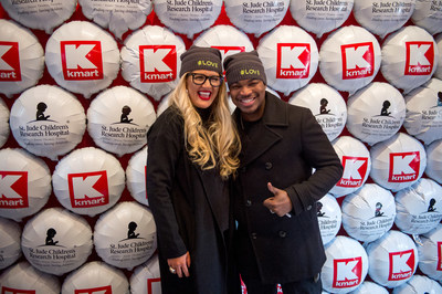 Kelly Cook, CMO for Kmart, and superstar NE-YO, celebrate at St. Jude Children's Research Hospital that the retailer raised more than $100 million in lifetime donations.