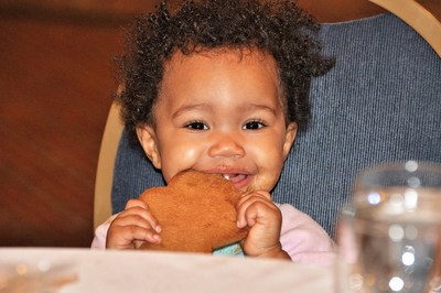 A veteran's baby enjoys the meal Wounded Warrior Project provided at their gathering.