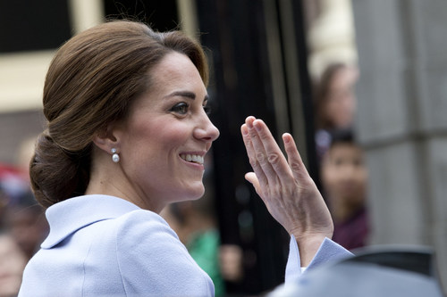 Britain's Kate, the Duchess of Cambridge, greets well-wishers as she arrives at the Mauritshuis Museum in The Hague, Netherlands, Tuesday, Oct. 11, 2016. (AP Photo/Peter Dejong)