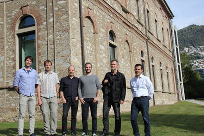 Photo caption, left to right: Nnaisense Co-Founders Bas Steunebrink, Jan Koutnik, Faustino Gomez (CEO), Jonathan Masci, and Jurgen Schmidhuber (president) with Alma Mundi Ventures Founding Partner Rajeev Singh-Molares outside of the University of Lugano library, Lugano, Switzerland. The startup's new investment from Singh-Molares' firm will be used to hire engineers and researchers to satisfy the growing need for Nnaisense's technology in industries such as manufacturing and financial services.