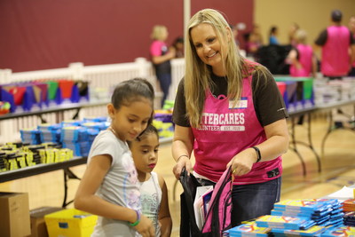 Otter Products employee, Megan Jacobson, helps stuff backpacks at Pack2School, a hometown event that provides backpacks and supplies, along with activities that teach philanthropy and entrepreneurship to thousands of students at the start of every school year in Northern Colorado.