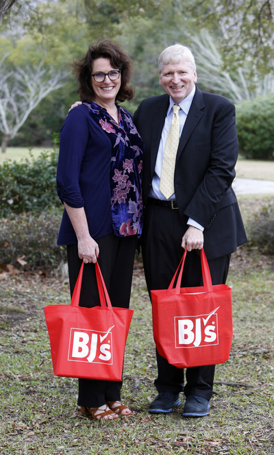 Kirk Saville, senior vice president, corporate communications at BJ's Wholesale Club (right) presents Robin Smith, teacher at Edmund A Burns Elementary School (left) on Thursday, Jan. 26, 2017, in Mount Pleasant, S.C. with the announcement that BJ's Wholesale Club has donated over $100,000 to help fund classroom projects in Summerville, Charleston and the surrounding areas in South Carolina through DonorsChoose.org. (Mic Smith/AP Images for BJ's Wholesale Club)