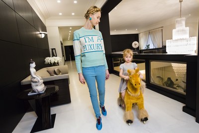 Ilona, a photographer and former model originally from Latvia, in the mezzanine library of her home, which so far contains only copies of a self-published book of her fashion photographs, Moscow, 2012. (C) Lauren Greenfield (image from the Annenberg Space for Photography exhibition, Lauren Greenfield's Generation Wealth)