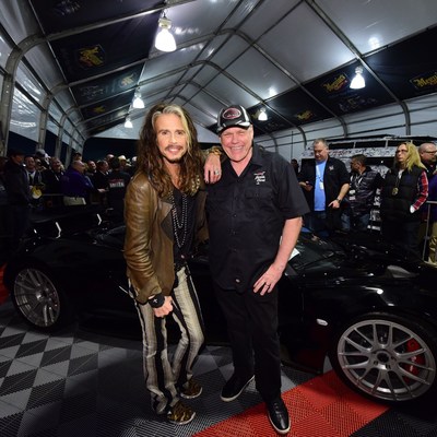 Steven Tyler and Craig Jackson get ready to auction Tyler's Hennessey Venom GT sports car for Janie's Fund at the Barrett-Jackson auction in Scottsdale, Arizona.