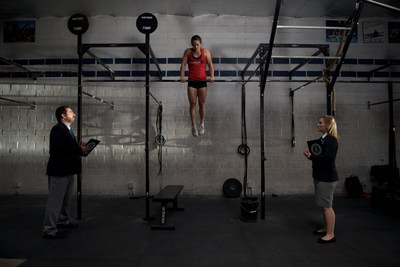 Camille Leblanc-Bazinet and Guinness judges during her attempt for most consecutive muscle ups