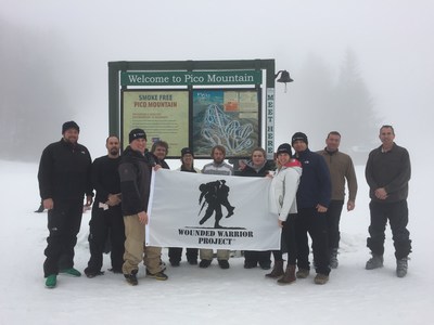 Wounded Warrior Project veterans pose for a picture at the bottom of Pico Mountain.