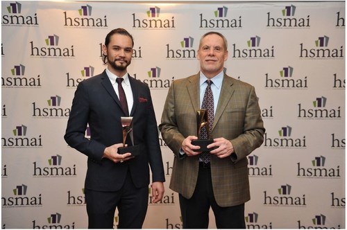 Daniel Durazo, Director of Communications at Allianz Worldwide Partners (right) and Justin Vallejo, Vice President at Finn Partners, accept awards at HSMAI Adrian Awards Dinner Reception and Gala in New York on February 21, 2017.