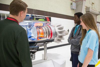 Chris Hickenbottom, Honeywell principal systems engineer, with CSO Jaiden (L) from Sierra Verde STEM Academy and CSO Kimberly (R) from Verrado High School at a Honeywell Hometown Solutions event in Phoenix.