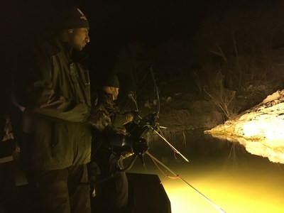 Veterans practice their bowfishing skills during a Wounded Warrior Project connection event.