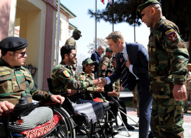 Michael Burns, CEO of the Invictus Games Toronto 2017, greets wounded warriors alongside Command Sergeant Major Roshan of the Afghanistan National Security Council, before a flag presentation ceremony at NATO headquarters in Kabul, Afghanistan, on March 14, 2017. (NATO photo by Captain Kay Nissen) (CNW Group/Invictus Games Toronto 2017)