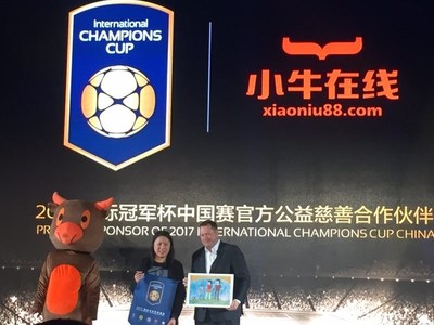 Neo Financial CEO Linda Wong and the International Champions Cup CEO exchange ICC crests and children's paintings