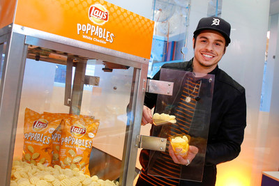 Creative director and choreographer Beau Casper Smart scoops Lay's Poppables at Dylan's Candy Bar, Thursday, March 16, 2017 in New York. The event celebrated the new multidimensional potato snack, Poppables. (Jason DeCrow/AP Images for AP Images for Lay's)