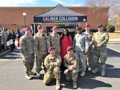 The first graduating cohort of Caliber Collision's Changing Lanes program with Monique Martin, recipient of the Recycled Rides vehicle the soldiers repaired and donated