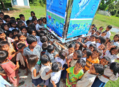 Children in rural Siem Reap, Cambodia gather around the Planet Water AquaTower; their source of clean, safe drinking water and hand washing.