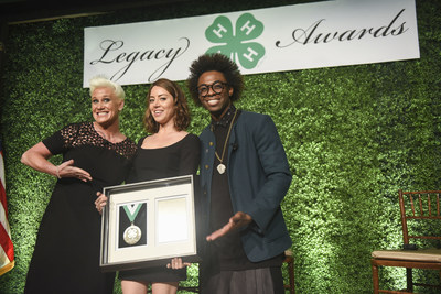 Chef, author and TV personality Anne Burrell, left, and chef and multimedia host Lazarus Lynch, right, present the Distinguished Alumni Medallion award to actress and producer Aubrey Plaza during the 8th annual National 4-H Council Legacy Awards on Tuesday, March 21, 2017, in Washington. (Kevin Wolf/AP Images for National 4-H Council)