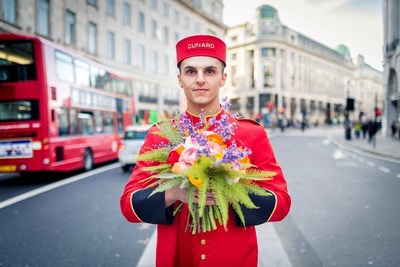 Cunard bellman showcasing Jenny Tobin bouquet in London.