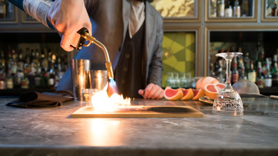 Head bartender Eric Trousdale of Arbella uses a Bernzomatic TS4000 torch to smoke his Laguna Salada cocktail to perfection, created in honor of National Cocktail Day on March 24.