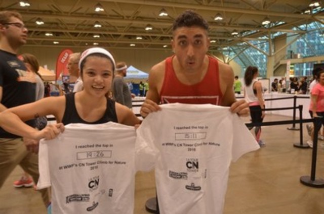 Climbers at WWF's 2016 CN Tower Climb show off their climb times. (CNW Group/WWF-Canada)