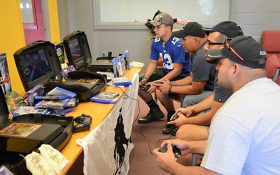 Veterans gather around to play the games donated by Operation Supply Drop.