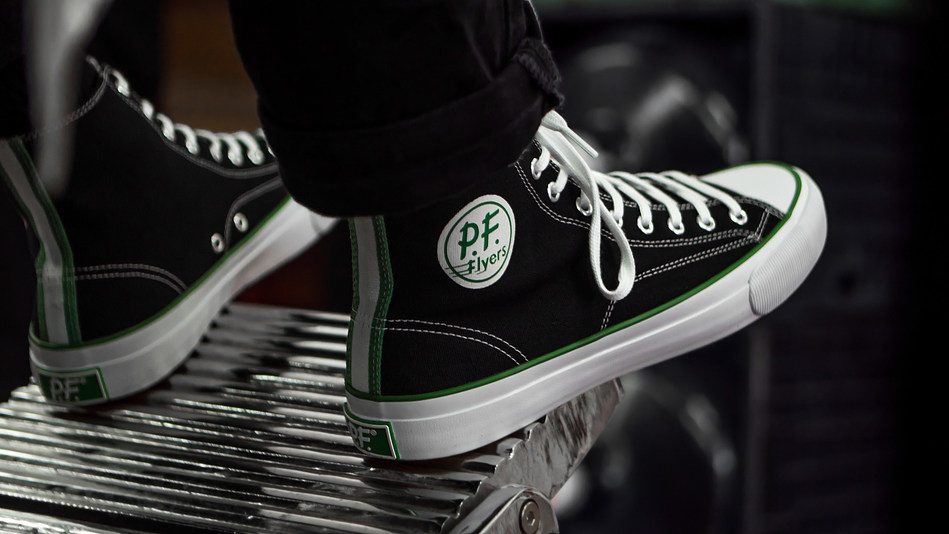 PF Flyers heritage meets New Balance performance technology in the newly redesigned All American. Based on one of PF Flyers' best sellers from the 1960's, the All American features vintage detailing and honors a tradition rooted in comfort. Original PF Flyers featured the celebrated 'Magic Wedge' insert, one of the sneaker industry's first innovations in comfort technology. Today, the All American features New Balance Fresh Foam insoles - a pioneering comfort platform.