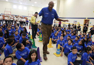 NBA Legend Bob Lanier towers over students at Victor Fields Elementary School before the start of a BBVA Compass/WNBA Cares event in McAllen, Texas, on April 6 to promote financial literacy. (NOTE TO USER: User expressly acknowledges and agrees that, by downloading and/or using this Photograph, user is consenting to the terms and conditions of the  Getty Images License Agreement. Mandatory Copyright Notice: Copyright 2017 NBAE (Photo by Nathan Lambrecht/NBAE via Getty Images)