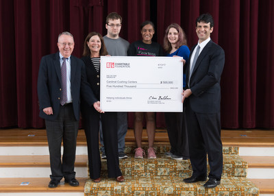 Lee Delaney, executive vice president and chief growth officer at BJ’s Wholesale Club (right), presents a two-year, $500,000 grant to Peter O’Meara, president and CEO of Cardinal Cushing Centers (left), and Jansi Chandler, vice president of development (second from left) in Hanover, Mass. on Thursday, April 13, 2017. Also pictured, starting from second from left, are Cardinal Cushing students Alex Endlich, Jai'lyn Jackson and Jordyn Cook. (Gretchen Ertl/AP Images for BJ's Wholesale Club)