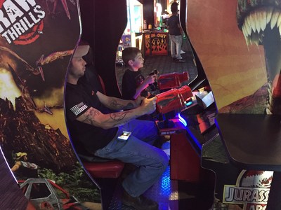 Veterans bond with their families during a day at the arcade. 