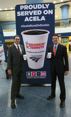 Dunkin’ Donuts Hot Coffee is now available on board Amtrak® Acela Express. The partnership kicked off April 19 with a sampling event in New York Penn Station. Pictured left to right is Thomas Hall, Amtrak Vice President, Passenger Experience; and David Hoffmann, President, Dunkin’ Donuts U.S. and Canada. (Photo/Stuart Ramson for Dunkin' Donuts)