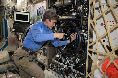 Expedition 51 Commander Peggy Whitson of NASA performs investigative troubleshooting in December 2016 on the Combustion Integrated Rack aboard the International Space Station. The rack includes an optics bench, combustion chamber, fuel and oxidizer control, and five different cameras for performing combustion experiments in microgravity. Credit: NASA