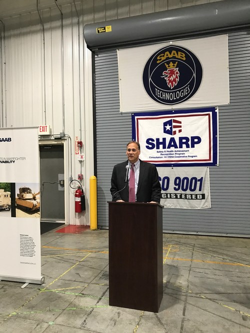 Brian Keller, President and General Manager of Saab Defense and Security USA in Lillington, introduces Larry Hall, North Carolina's Veterans and Military Affairs Secretary.
