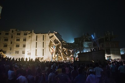 Thousands gather at the Rana Plaza as rescue workers and volunteers attempt to find survivors in the rubble of the collapsed building. Photo by Ismail Ferdous (CNW Group/ROCHON GENOVA LLP)