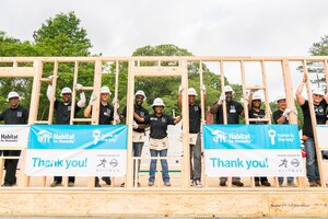 Football legends team up with Habitat for Humanity and Nissan to build "Heisman House"