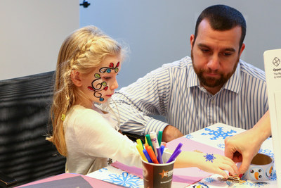 Mark O’Grady, Information Systems Auditor, and his daughter at an OppenheimerFunds Children’s event.