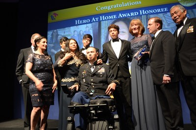 Claudia (second from left) and U.S. Army Captain Luis Avila on stage with their three sons, PenFed Foundation CEO James Schenck (second from right), The Honorable Frederick Pang, Chairman of the PenFed Foundation (far right), Tammy Darvish, PenFed Foundation President (far left) and Julie Keys, 2016 Hero at Home Award recipient.