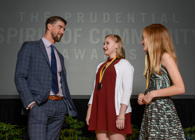 Olympic gold medalist Michael Phelps congratulates Elizabeth Lipp, 16, of Mountain Brook (center) and Louise Adair, 13, of Tuscaloosa (right) on being named Alabama's top two youth volunteers for 2017 by The Prudential Spirit of Community Awards. Elizabeth and Louise were honored at a ceremony on Sunday, May 7 at the Smithsonian's National Museum of Natural History, where they each received a $1,000 award.