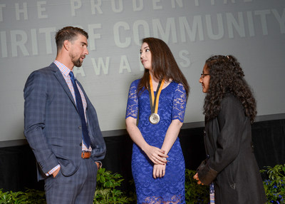 Olympic gold medalist Michael Phelps congratulates Emma Albertoni, 18, of Arvada (center) and Breanna Remigio, 14, of Aurora (right) on being named Colorado's top two youth volunteers for 2017 by The Prudential Spirit of Community Awards. Emma and Breanna were honored at a ceremony on Sunday, May 7 at the Smithsonian's National Museum of Natural History, where they each received a $1,000 award.