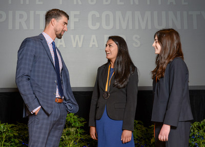 Olympic gold medalist Michael Phelps congratulates Isha Dalal, 17 (center) and Rachel Weintraub, 13 (right), both of Trumbull, on being named Connecticut's top two youth volunteers for 2017 by The Prudential Spirit of Community Awards. Isha and Rachel were honored at a ceremony on Sunday, May 7 at the Smithsonian's National Museum of Natural History, where they each received a $1,000 award.