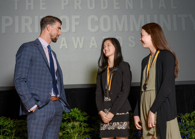 Olympic gold medalist Michael Phelps congratulates Grace Zhang, 18, of Carmel (center) and Tara Harmon, 14, of Zionsville (right) on being named Indiana's top two youth volunteers for 2017 by The Prudential Spirit of Community Awards. Grace and Tara were honored at a ceremony on Sunday, May 7 at the Smithsonian's National Museum of Natural History, where they each received a $1,000 award.