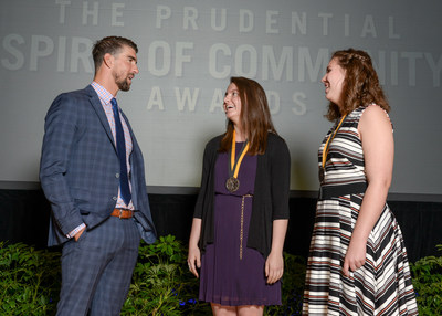 Olympic gold medalist Michael Phelps congratulates Jennifer Jenks, 17, of Aurora (center) and Aliza Woodford, 14, of Emmetsburg (right) on being named Iowa's top two youth volunteers for 2017 by The Prudential Spirit of Community Awards. Jennifer and Aliza were honored at a ceremony on Sunday, May 7 at the Smithsonian's National Museum of Natural History, where they each received a $1,000 award.