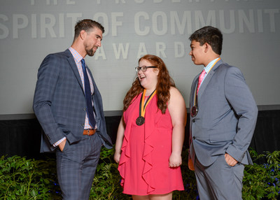 Olympic gold medalist Michael Phelps congratulates Anna-Maria Beck, 17 (center) and Andrew Dunn, 14 (right), both of Louisville, on being named Kentucky's top two youth volunteers for 2017 by The Prudential Spirit of Community Awards. Anna-Maria and Andrew were honored at a ceremony on Sunday, May 7 at the Smithsonian's National Museum of Natural History, where they each received a $1,000 award.