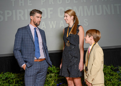 Olympic gold medalist Michael Phelps congratulates Anna Katherine Tollett, 16, of Ruston (center) and Zach Morgan, 12, of Denham Springs (right) on being named Louisiana's top two youth volunteers for 2017 by The Prudential Spirit of Community Awards. Anna Katherine and Zach were honored at a ceremony on Sunday, May 7 at the Smithsonian's National Museum of Natural History, where they each received a $1,000 award.