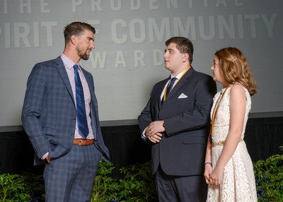 Olympic gold medalist Michael Phelps congratulates Casey Arruda, 17, of Somerset (center) and Ella Morrison, 11, of Middleboro (right) on being named Massachusetts' top two youth volunteers for 2017 by The Prudential Spirit of Community Awards. Casey and Ella were honored at a ceremony on Sunday, May 7 at the Smithsonian's National Museum of Natural History, where they each received a $1,000 award.