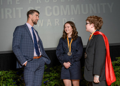 Olympic gold medalist Michael Phelps congratulates Sarah Maisano, 17, of Clinton Township (center) and Ewan Drum, 10, of New Haven (right) on being named Michigan's top two youth volunteers for 2017 by The Prudential Spirit of Community Awards. Sarah and Ewan were honored at a ceremony on Sunday, May 7 at the Smithsonian's National Museum of Natural History, where they each received a $1,000 award.