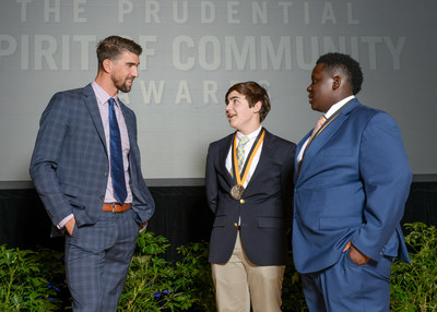 Olympic gold medalist Michael Phelps congratulates Luke Kelly, 16, of Water Valley (center) and Davian Powell, 14, of Lexington (right) on being named Mississippi's top two youth volunteers for 2017 by The Prudential Spirit of Community Awards. Luke and Davian were honored at a ceremony on Sunday, May 7 at the Smithsonian's National Museum of Natural History, where they each received a $1,000 award.